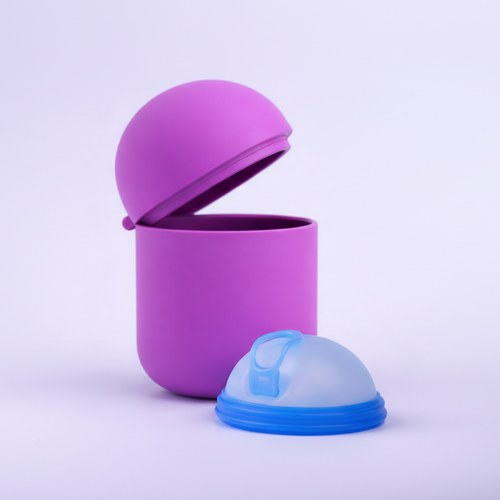 Bohokiwi Dark Purple steriliser pod open beside an Ocean Blue menstrual disc