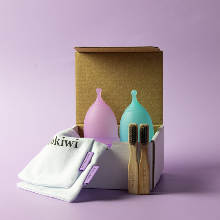 Bohokiwi Lavender and Sapphire Blue menstrual cup twin pack with cotton storage bags and bamboo cleaning brushes