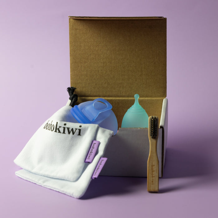 Bohokiwi Ocean Blue menstrual disc and Sapphire Blue menstrual cup set with cotton storage bags and bamboo cleaning brush
