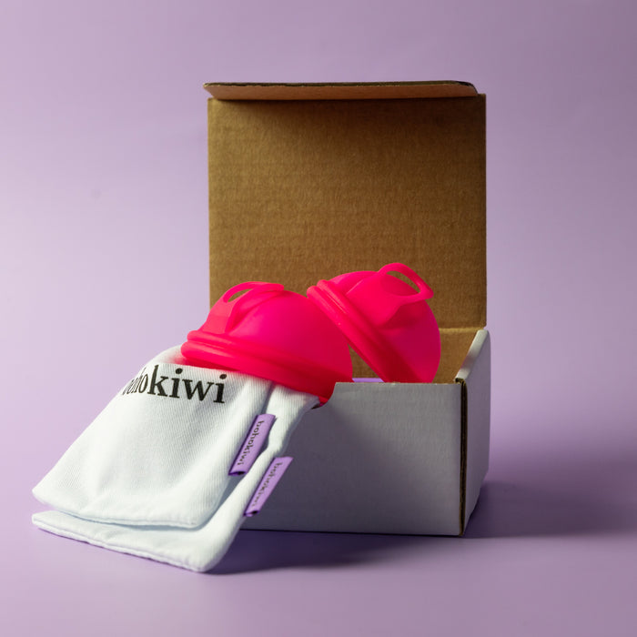 Bohokiwi reusable menstrual disc two pack featuring Neon Pink discs with cotton storage bags