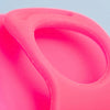 Close-up of Bohokiwi Neon Pink menstrual disc showing the flexible rim and removal ring