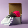 Bohokiwi Neon Pink and Midnight Black menstrual discs with cotton storage bags and box