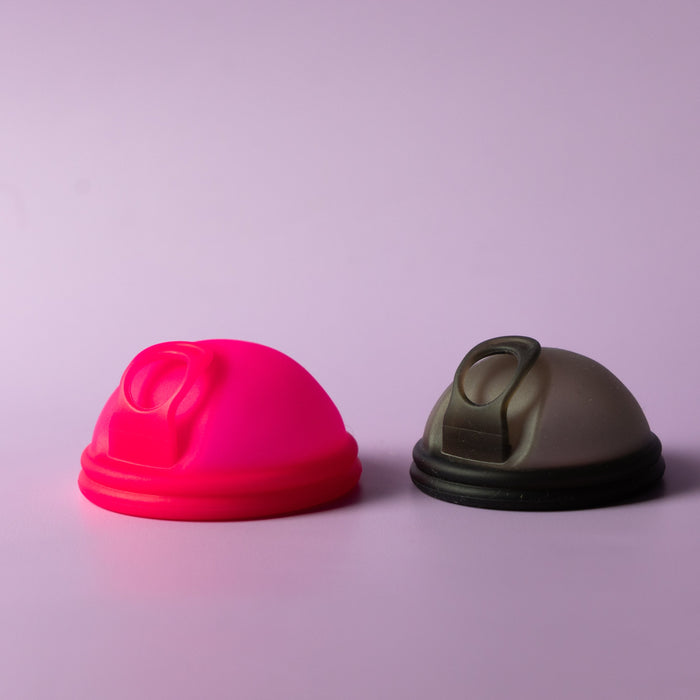 Bohokiwi Neon Pink and Midnight Black reusable menstrual discs with removal rings