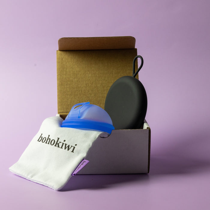 Bohokiwi Ocean Blue menstrual disc with Black round carrier case and cotton storage bag