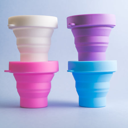 Bohokiwi collapsible menstrual cup and disc sterilisers in Snow White, Purple, Hot Pink and Sky Blue