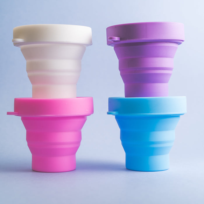 Bohokiwi collapsible menstrual cup and disc sterilisers in Snow White, Purple, Hot Pink and Sky Blue