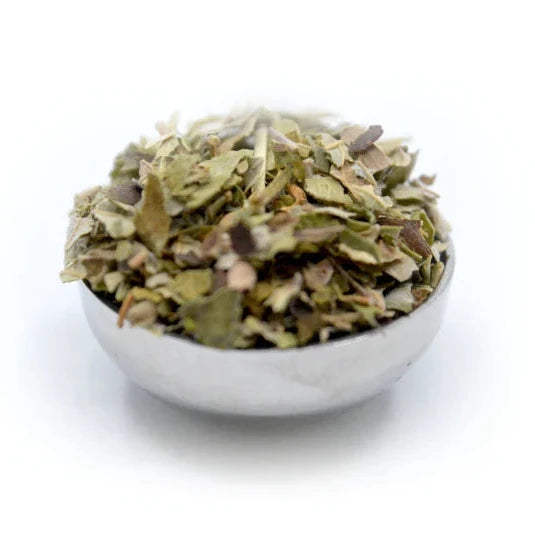 Cup of dried raspberry leaf herbal tea leaves